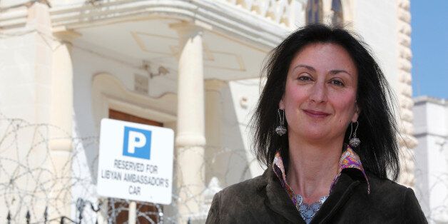 Maltese investigative journalist Daphne Caruana Galizia poses outside the Libyan Embassy in Valletta April 6, 2011. Investigative journalist Caruana Galizia was killed after a powerful bomb blew up a car killing her in Bidnija, Malta, in October 16, 2017. Picture taken April 6, 2011. REUTERS/Darrin Zammit Lupi