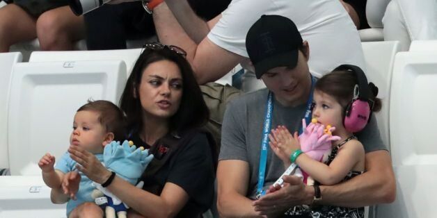 US actors Ashton Kutcher and his wife Mila Kunis attend the diving competition at the 2017 FINA World Championships in Budapest, on July 17, 2017. / AFP PHOTO / STRINGER (Photo credit should read STRINGER/AFP/Getty Images)