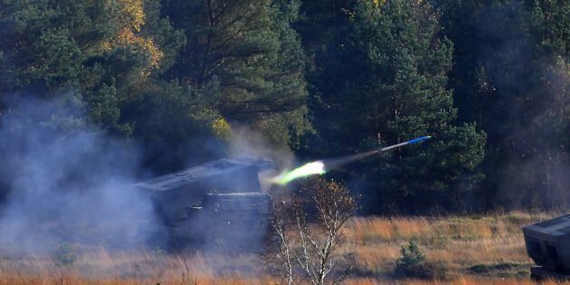 A 'Mars 2' rocket launcher of the German armed forces Bundeswehr fires during the informative educational practice 'Land Operation Exercise 2017' at the military training area in Munster, northern Germany, on October 13, 2017. / AFP PHOTO / PATRIK STOLLARZ (Photo credit should read PATRIK STOLLARZ/AFP/Getty Images)
