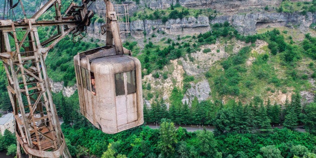 CHIATURA, GEORGIA - JUNE 2014:The cable car network spans 6,000 meters in, Chiatura, Georgia, June 2014.THE morning commute is stressful for most, but have sympathy for the residents of a small mining town who have to travel in rusted cable cars that are more than 60 years old. Located in the town of Chiatura, Georgia, you would be forgiven for thinking you have been teleported back to the Cold War period. Built in the 1950s by the Soviet Union to transport workers around the mining town quicker the cable cars transport visitors to a by gone era. Photographer Ioanna Sakellaraki, 26, travelled to the old mining town to snap one of the worlds longest cable car networks which boasts 17 functioning cabins and car lines that span more than 6,000 metres (3.7 miles).PHOTOGRAPH BY Ioanna Sakellaraki / Barcroft ImagesLondon-T:+44 207 033 1031 E:hello@barcroftmedia.com -New York-T:+1 212 796 2458 E:hello@barcroftusa.com -New Delhi-T:+91 11 4053 2429 E:hello@barcroftindia.com www.barcroftimages.com (Photo credit should read Ioanna Sakellaraki / Barcroft Im / Barcroft Media via Getty Images)