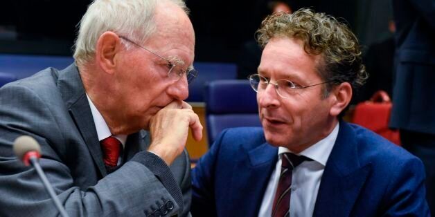German Finance Minister Wolfgang Schaeuble (L) talks with Dutch Finance Minister and President of the Eurogroup, Jeroen Dijsselbloem during a Eurozone Finance ministers meeting in Luxembourg on October 9, 2017. German Finance Minister Wolfgang Schaeuble, the warhorse of the debt crisis, attends his final meeting of eurozone ministers on October 9 as variously the most loathed or loved figures in EU politics. / AFP PHOTO / JOHN THYS (Photo credit should read JOHN THYS/AFP/Getty Images)