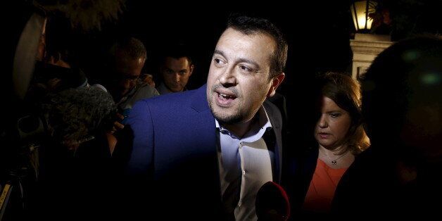 Greek State Minister Nikos Pappas talks to journalists outside the Maximos Mansion in Athens, Greece June 27, 2015. Greece will hold a referendum on July 5 to decide whether the country should accept or reject a bailout agreement offered by creditors, Prime Minister Alexis Tsipras said in a late-night address to the nation. REUTERS/Alkis Konstantinidis