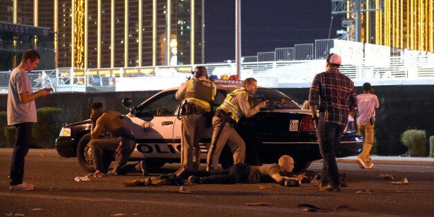 LAS VEGAS, NV - OCTOBER 01: Las Vegas police stand guard along the streets outside the the Route 91 Harvest country music festival grounds after a active shooter was reported on October 1, 2017 in Las Vegas, Nevada. There are reports of an active shooter around the Mandalay Bay Resort and Casino. (Photo by David Becker/Getty Images)