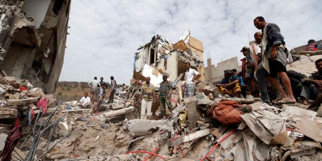 TOPSHOT - Yemenis search under the rubble of a house destroyed in an air strike in the residential southern Faj Attan district of the capital Sanaa on August 25, 2017.The attack destroyed two buildings in the southern district of Faj Attan, leaving people buried under debris, witnesses and medics said. / AFP PHOTO / Mohammed HUWAIS (Photo credit should read MOHAMMED HUWAIS/AFP/Getty Images)