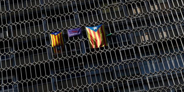 Esteladas (Catalan separatist flag) hang from windows in Barcelona, Spain October 5, 2017. REUTERS/Yves Herman
