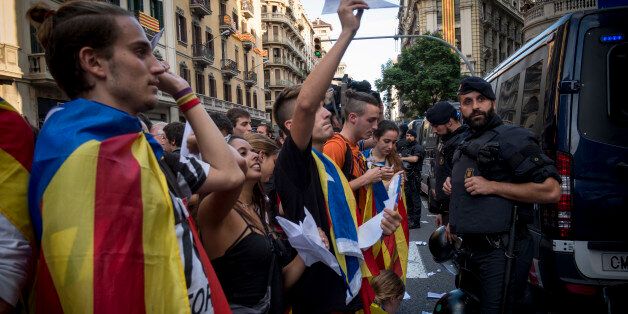 Later during the day, in front of a Police headquarter, hundreds of Catalans gather to protest against the present of the National police. Despite of the victory on the referendum voting, more protests occur in Barcelona, Spain, on 2 October 2017. In the center of the city, mainly students, thousands of them, gather in a silence march. They demonstrate to support democracy after the results of the votes. Later during the day, in front of a main police headquarter, hundreds of people, supervised