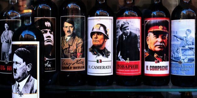 A picture taken on September 14, 2017 shows bottles of wine with pictures of Mussolini, Hitler, Lenin and Stalin at a shop in the center of Rome.Italy's lower house of Parliament voted for the introduction of an article in the penal code punishing 'anyone who propagates the images or contents of the Italian former Fascist Party or the German former Nazist Party' affects production, distribution, diffusion or sale of goods depicting people, images or symbols, and increase of one-third of the punishment for the crimes committed through the web, the rectification of the law is now awaiting voting in the Senate. / AFP PHOTO / Alberto PIZZOLI (Photo credit should read ALBERTO PIZZOLI/AFP/Getty Images)