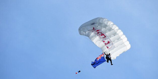 EVIAN-LES-BAINS, FRANCE - SEPTEMBER 13: A skydiver lands with an Australian flag after the final round of the Evian Championship Golf on September 13, 2015 in Evian-les-Bains, France. (Photo by Stuart Franklin/Getty Images)