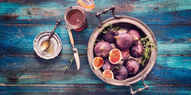 Figs and Sweet Honey on Wooden Background