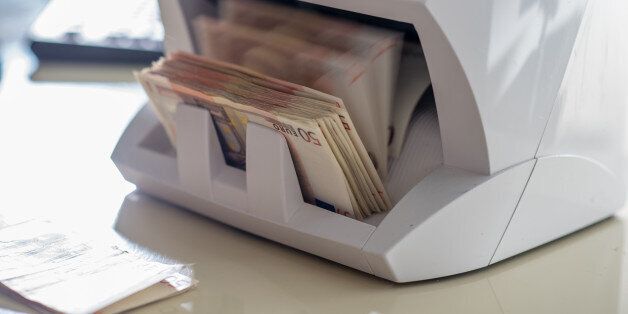 Close-up of machine for counting money.