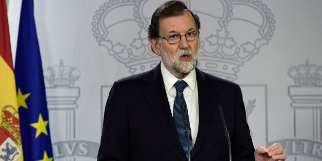 Spanish Prime Minister Mariano Rajoy speaks during a press conference at La Moncloa palace in Madrid on October 1, 2017.Spanish riot police firing rubber bullets forced their way into activist-held polling stations in Catalonia today as thousands turned out to vote in an independence referendum banned by Madrid. At least 92 people were confirmed injured in clashes out of a total of 465 who went to hospital, emergency services said, as police cracked down on a vote the Spanish central government branded a 'farce'. / AFP PHOTO / JAVIER SORIANO (Photo credit should read JAVIER SORIANO/AFP/Getty Images)
