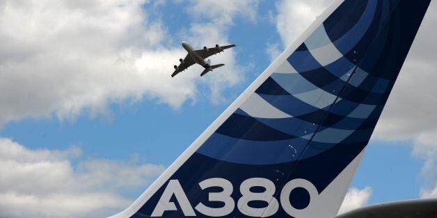 An Airbus A380 performs a flying display at Le Bourget airport, near Paris, on June 24, 2017 during the public days the International Paris Air Show. / AFP PHOTO / ERIC PIERMONT (Photo credit should read ERIC PIERMONT/AFP/Getty Images)