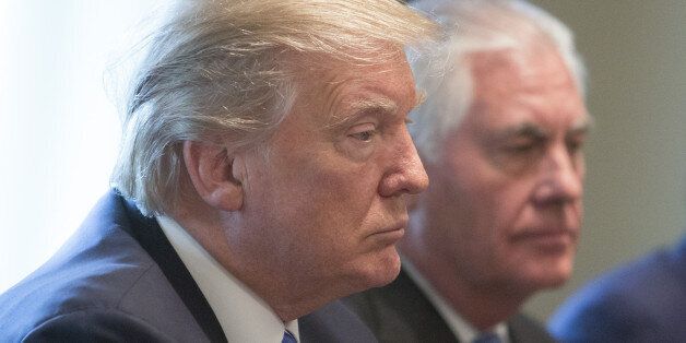 U.S. President Donald Trump, left, and Rex Tillerson, U.S. secretary of State, attend a cabinet meeting with Najib Razak, Malaysia's prime minister, not pictured, in the Cabinet Room of the White House in Washington, D.C., U.S., on Tuesday, Sept. 12, 2017. As Najib meets former golf partner Trump today, the elephant in the room will be a U.S. criminal probe of an investment fund linked to Najib. The 1Malaysia Development Bhd. (1MDB) probe, which began during Barack Obama's administration, has focused global scrutiny on the Malaysian government's business dealings under Najib, in power since 2009. Photographer: Chris Kleponis/Pool via Bloomberg