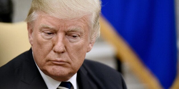 WASHINGTON, DC - OCTOBER 2: (AFP-OUT) President Donald Trump looks on during a meeting with Prime Minister Prayut Chan-o-cha of Thailand in the Oval Office of the White House October 2, 2017 in Washington, DC. The White House will most likely press Chan-o-cha to add pressure on North Korea to curtail or end its growing nuclear weapons program. (Photo by Olivier Douliery-Pool/Getty Images)