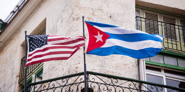 US and Cuban flags side by side in Havana, Cuba