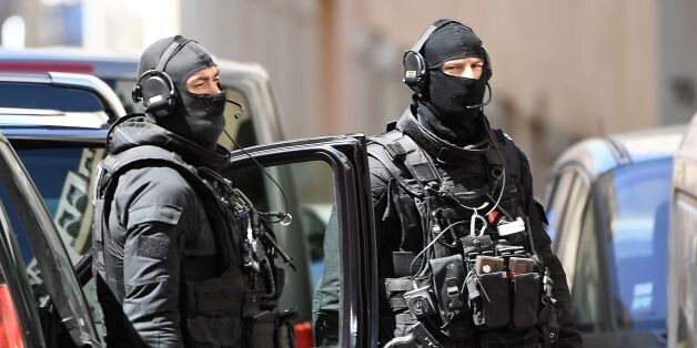 Members of the French RAID police unit leave after searching the home of one of two men arrested in Marseille on April 18, 2017 after they were suspected of plotting an 'imminent' attack in France, days from presidential polls.French authorities found guns and bomb-making materials after the arrest of the two men, sources close to the probe said. The items were discovered during searches in the southern city of Marseille after the suspects -- 'radicalised' Frenchmen aged 23 and 29 -- were taken into custody, sources said. / AFP PHOTO / BORIS HORVAT (Photo credit should read BORIS HORVAT/AFP/Getty Images)