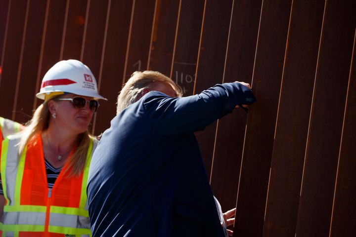 President Donald Trump signed his name on a section of the U.S.-Mexico border wall during a tour of the Otay Mesa area on Wednesday.