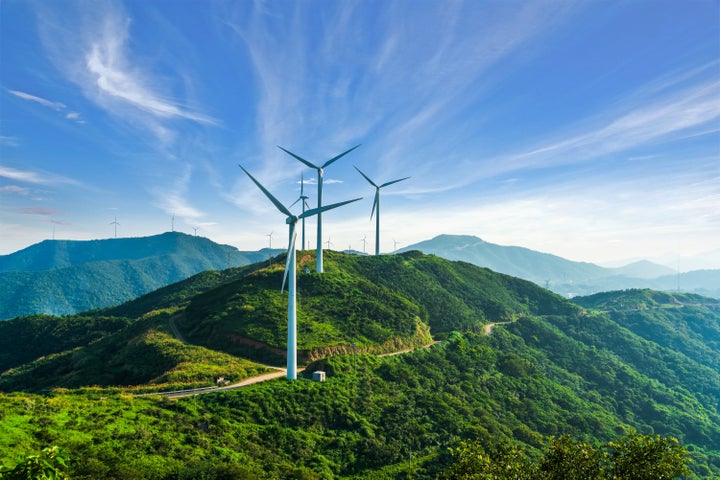 Wind turbines in Zhejiang province, China. In many places wind and solar power are already cheaper than fossil fuels.