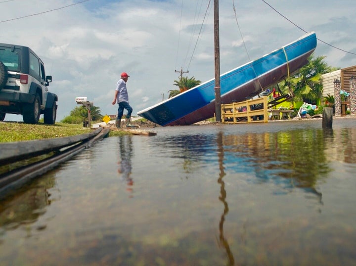 The hull of a boat is tipped over in Sargent, Texas, Wednesday, Sept. 18, 2019.