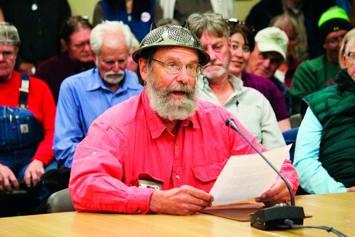 Fritz Creek area resident Barrett Fletcher gives the invocation before a Kenai Peninsula Borough Assembly meeting as a repres