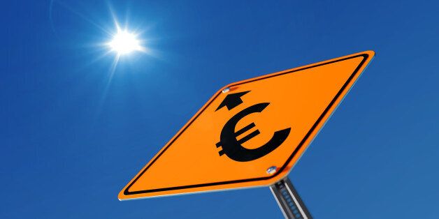 Yellow Euro prosperity ahead traffic sign on blue sky. Euro prosperity concept. Low Angle view. Horizontal composition with copy space. Clipping path is included.