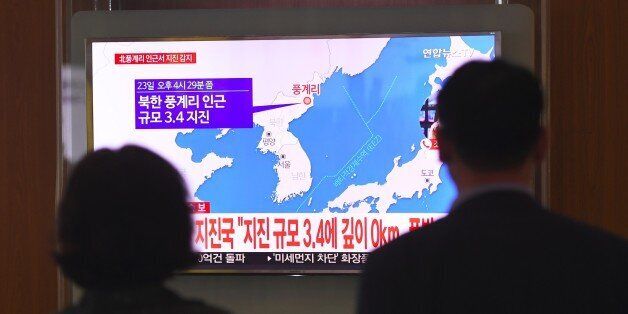 People watch a television news screen showing a map of the epicenter of an earthquake in North Korea, at a railway station in Seoul on September 23, 2017.China's seismic service CENC on September 23 detected a zero-depth, 3.4-magnitude earthquake in North Korea, calling it a 'suspected explosion'. There seemed to be some initial difference of opinion, however, with Seoul's Korea Meteorological Agency (KMA) saying that it had registered a tremor of a similar size, but judged it a 'natural quake'. / AFP PHOTO / JUNG Yeon-Je (Photo credit should read JUNG YEON-JE/AFP/Getty Images)