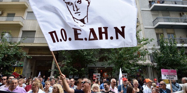 ATHENS, GREECE - OCTOBER 06: Public hospital employees protest in front of the Ministry of Health in Athens demanding improvements in the healthcare sector on October 6, 2016 in Athens, Greece. (Photo by Nicolas Koutsokostas/Corbis via Getty Images)