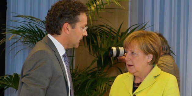 BRUSSELS, BELGIUM - JUNE 22: German Chancellor Angela Merkel (R) and Eurogroup President and Dutch Finance Minister Jeroen Dijsselbloem talk together at the European Union headquarters before the Euro Summit to discuss the situation of Greece, 22 June 2015, in Brussels, Belgium. (Photo by European Council Press Office/Anadolu Agency/Getty Images)