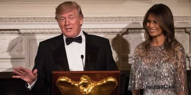 US President Donald Trump speaks alongside First Lady Melania Trump as they host the White House Historical Association dinner at the White House in Washington, DC, on September 14, 2017. / AFP PHOTO / NICHOLAS KAMM (Photo credit should read NICHOLAS KAMM/AFP/Getty Images)