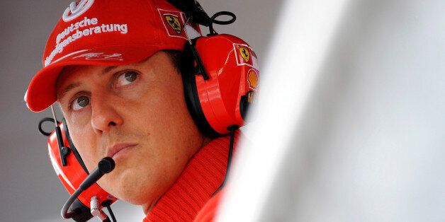 Former Ferrari driver Michael Schumacher of Germany looks on during the qualifying session for the Italian F1 Grand Prix race at the Monza racetrack in Monza, near Milan, in this September 13, 2008 file photo. REUTERS/Alessandro Bianchi/File Photo