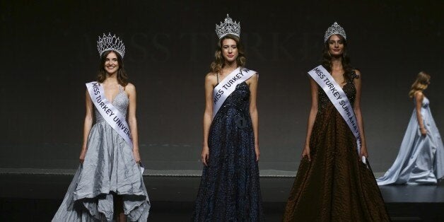 ISTANBUL, TURKEY - SEPTEMBER 21 : Winner contestants Itir Esen (C), crowned as Miss Turkey World, Asli Sumen (L), crowned as Miss Turkey Universe and Pinar Tartan (R), crowned as Miss Turkey Supranational, are seen at the end of the Miss Turkey 2017 beauty contest at the Grand Pera Emek Stage in Istanbul, Turkey on September 21, 2017. (Photo by Emrah Yorulmaz/Anadolu Agency/Getty Images)