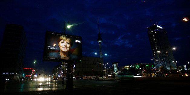 An election campaign poster for the upcoming general elections of the Christian Democratic Union party (CDU) with a headshot of German Chancellor Angela Merkel is displayed at Alexanderplatz square in Berlin, Germany, September 21, 2017. REUTERS/Hannibal Hanschke