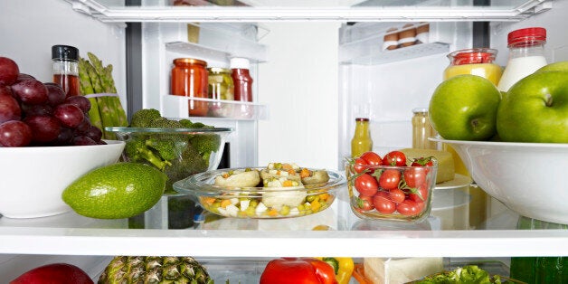 Fridge full of fruits, vegetables and diary products.