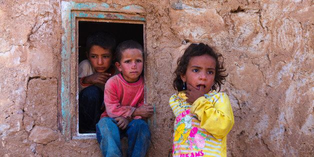 Urfa, Turkey - September 20, 2009 : Seasonal agricultural worker's children in Harran Province.Some of them even has no shoes to wear.They live in a village very near the Syrian border.
