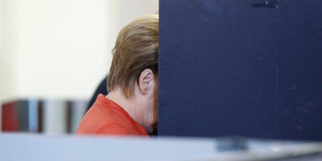 German Chancellor and CDU party leader Angela Merkel casts her ballot at a polling station on September 24, 2017 in Berlin during general elections. / AFP PHOTO / Odd ANDERSEN (Photo credit should read ODD ANDERSEN/AFP/Getty Images)