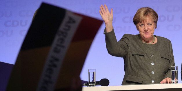Angela Merkel, Germany's chancellor and Christian Democratic Union (CDU) leader, waves during an election campaign rally in Hamburg, Germany, on Wednesday, Sept. 20, 2017. Merkel urged German voters to keep the political center strong in Sunday's election, suggesting concern about polls showing gains by the left and right fringes at the expense of the two biggest parties. Photographer: Krisztian Bocsi/Bloomberg via Getty Images