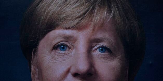 A billboard featuring German Chancellor and leader of the conservative Christian Democratic Union (CDU) party Angela Merkel is pictured in front of the TV Tower in Berlin on September 17, 2017, a week before Germans head to the polls. / AFP PHOTO / John MACDOUGALL (Photo credit should read JOHN MACDOUGALL/AFP/Getty Images)