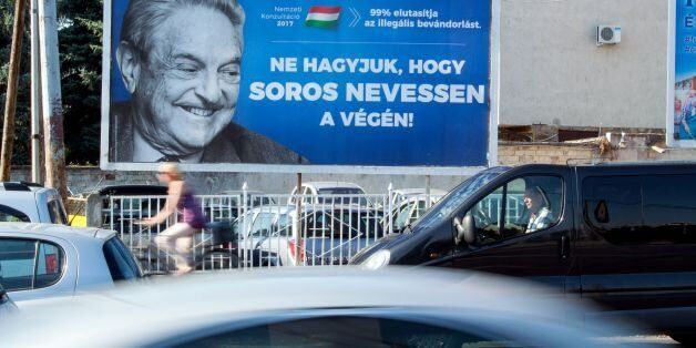 A poster with US billionaire George Soros is pictured on July 6, 2017 in Szekesfehervar, Hungary.The head of Hungary's largest Jewish organisation says a 'poisonous' poster campaign by the government that targets US billionaire George Soros is stoking anti-Semitic sentiments and urged its immediate scrapping. / AFP PHOTO / ATTILA KISBENEDEK / TO GO WITH AFP STORY (Photo credit should read ATTILA KISBENEDEK/AFP/Getty Images)