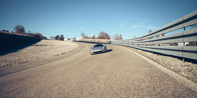 WEISSACH, GERMANY - DECEMBER 2016: Former rally champion Walter Rohl races a shimmering silver Porsche model around the track using technology it brought to the street on December 10, 2016 in Weissach, Germany. PORSCHE has revealed their top five technologies that made the incredible transition from the racetrack to the street, in the fourth episode of a weekly YouTube series. Former Porsche world champion rally driver Walter RÃ¶hl presented the episode from the track located in Weissach that is part of the Porsche development center. The E-Performance Concept ranked top of the technological transitions with its performance and eco-friendly advantages. The other technologies that made the list included turbochargers, ceramic disk brakes, mode switch and carbon fiber reinforced polymer. The Porsche 356 was the first model that moved from the racetrack to the street. To see more Porsche Top 5 videos visit: www.youtube.com/porschePHOTOGRAPH BY Porsche / Barcroft ImagesLondon-T:+44 207 033 1031 E:hello@barcroftmedia.com -New York-T:+1 212 796 2458 E:hello@barcroftusa.com -New Delhi-T:+91 11 4053 2429 E:hello@barcroftindia.com www.barcroftimages.com (Photo credit should read Porsche / Barcroft Images / Barcroft Media via Getty Images)