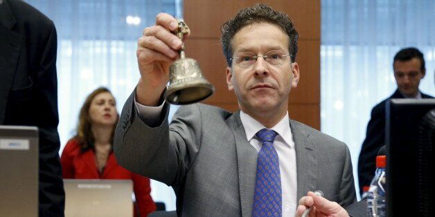 Eurogroup President Jeroen Dijsselbloem rings the bell at the start of a euro zone finance ministers meeting in Brussels, Belgium, July 13, 2015. Euro zone finance ministers will discuss bridge financing for Greece on Monday at their meeting in Brussels after leaders agreed on a roadmap to a possible third bailout. REUTERS/Francois Lenoir