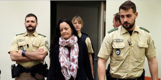 Defendant Beate Zschaepe (2nd L) arrives at a courtroom on September 12, 2017 in Munich, southern Germany.German prosecutors sought life in jail for the surviving member of a German neo-Nazi trio accused of a string of racist murders that targeted mostly Turkish immigrants. Beate Zschaepe is co-accused in the 10 killings carried out by the other two members of the self-styled National Socialist Underground (NSU), Uwe Mundlos and Uwe Boehnhardt, between 2000 and 2007. / AFP PHOTO / dpa / Matthias Schrader / Germany OUT (Photo credit should read MATTHIAS SCHRADER/AFP/Getty Images)
