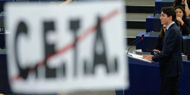 Canada's Prime Minister Justin Trudeau is seen behind a poster with a crossed CETA (Comprehensive Economic Trade Agreement) sign as he adresses the European Parliament in Strasbourg, France, February 16, 2017. REUTERS/Vincent Kessler