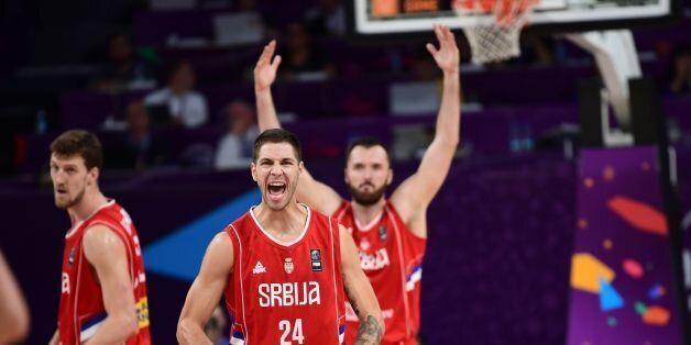 Serbia's forward Stefan Jovic (C) and Milan Macvan (R) celebrate after scoring during the FIBA Eurobasket 2017 men's Semi Final basketball match between Russia and Serbia at Sinan Erdem Sport Arena in Istanbul on September 15, 2017. / AFP PHOTO / OZAN KOSE (Photo credit should read OZAN KOSE/AFP/Getty Images)