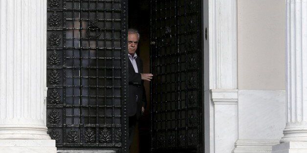 Greek Deputy Prime Minister Yannis Dragasakis leaves following a government council at the Prime Minister Alexis Tsipras (not pictured) office in Maximos mansion in Athens June 21, 2015. Greece's leftwing government believes it can reach a deal with its creditors, Finance Minister Yanis Varoufakis said on Sunday after almost eight hours of meetings to thrash out proposals ahead of a last-ditch summit with European leaders on Monday. REUTERS/Alkis Konstantinidis