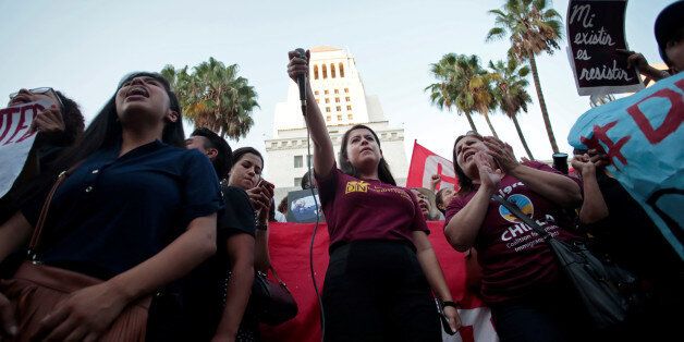 Melanie, a Deferred Action for Childhood Arrivals (DACA) program recipient, leads a chant with supporters at City Hall in Los Angeles, California, September 5, 2017. REUTERS/ Kyle Grillot
