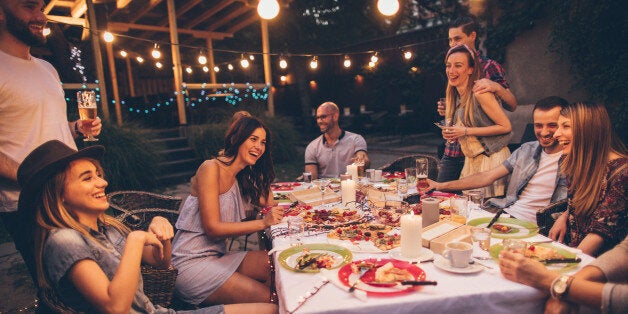 Photo of a cheerful friends having gathering in a local bistro