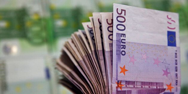A picture illustration shows Euro banknotes in Zenica January 26, 2015. The European Central Bank's quantitative easing program will be enough to bring inflation back to target, a slim majority of euro zone money market traders polled by Reuters said. Eleven of 19 traders polled said the ECB's near trillion euro QE would bring inflation close to 2 percent. Economists polled by Reuters immediately after Thursday's announcement had narrowly said it would not. REUTERS/Dado Ruvic (BOSNIA AND HERZEGOVINA - Tags: BUSINESS POLITICS)