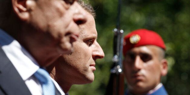 Greek President Prokopis Pavlopoulos escorts his French counterpart Emmanuel Macron as they inspect a guard of honour during a welcome ceremony in Athens, Greece, September 7, 2017. REUTERS/Alkis Konstantinidis