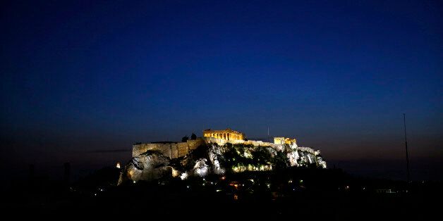 The temple of Parthenon is illuminated atop the Athens Acropolis February 15, 2015. Greece has agreed with its European partners that there needs to be a