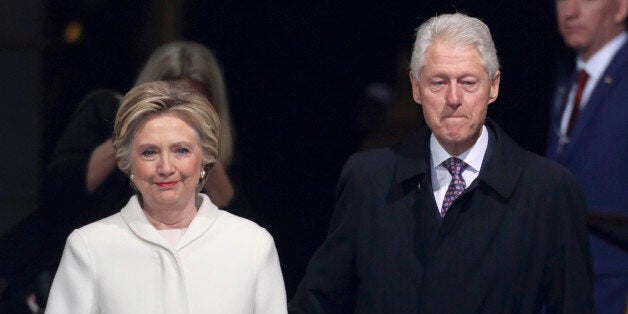 Former president Bill Clinton (R) and former Democratic presidential candidate Hillary Clinton arrive at inauguration ceremonies swearing in Donald Trump as the 45th president of the United States on the West front of the U.S. Capitol in Washington, U.S., January 20, 2017. REUTERS/Carlos Barria